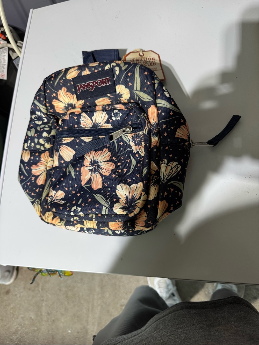 Jansport Navy Mini pack with Peach Floral Print